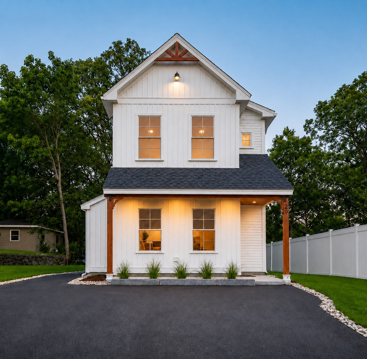 Custom modern farmhouse home built by Elm St Development in Massachusetts, at dusk