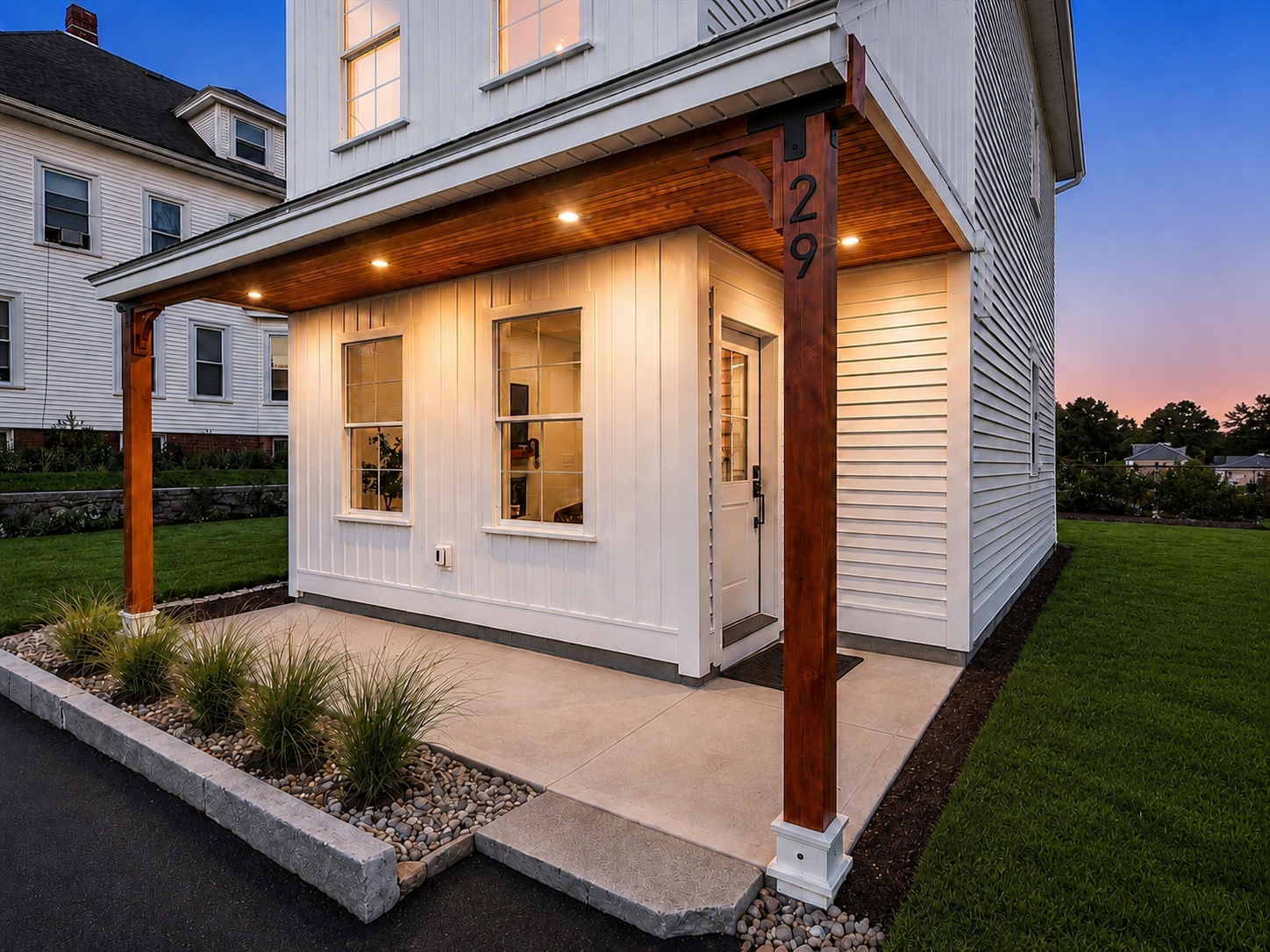 Front porch with cedar timber posts at dusk