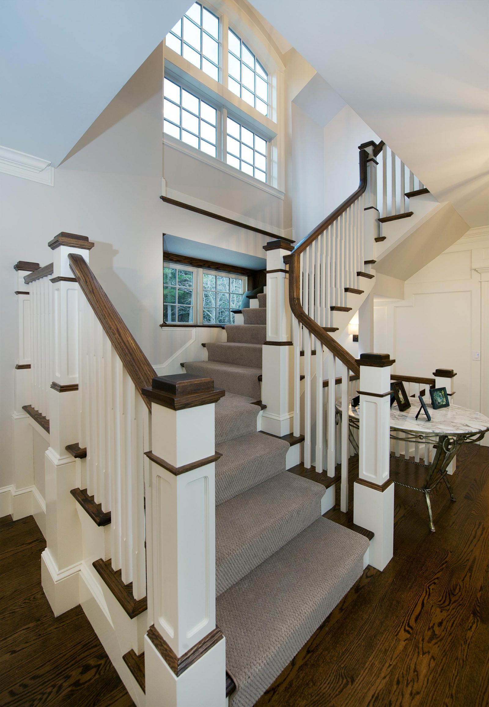 Custom staircase with arched window